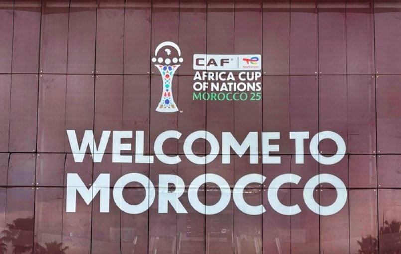 Football players on pitch during match