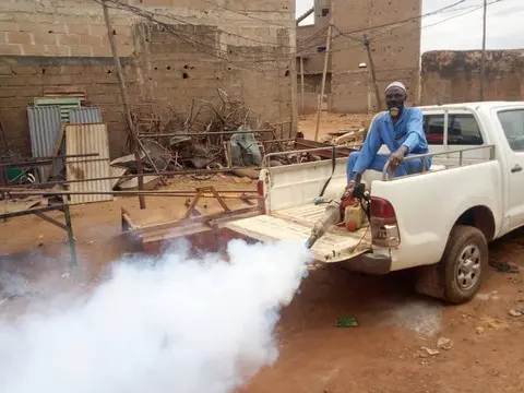 Health workers conducting mosquito control operations in Mali