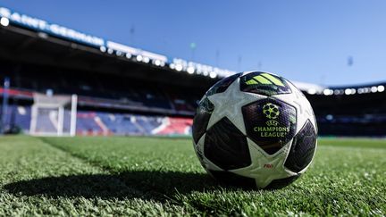 Official champions league ball on the Parc des Princes pitch