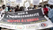 Protesters in Dakar hold signs reading 'no to homosexuality' during a 2025 demonstration
