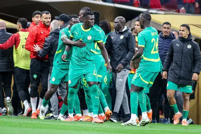 Senegal team protesting against the referee