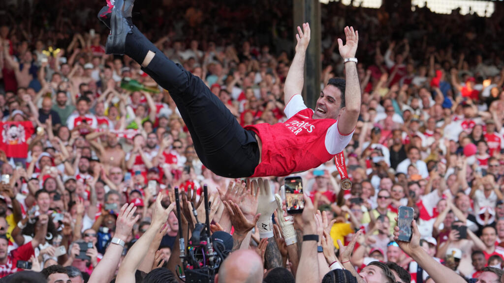 Arsenal manager Mikel Arteta being carried by his players after clinching the Premier League title at Crystal Palace on May 24, 2026.