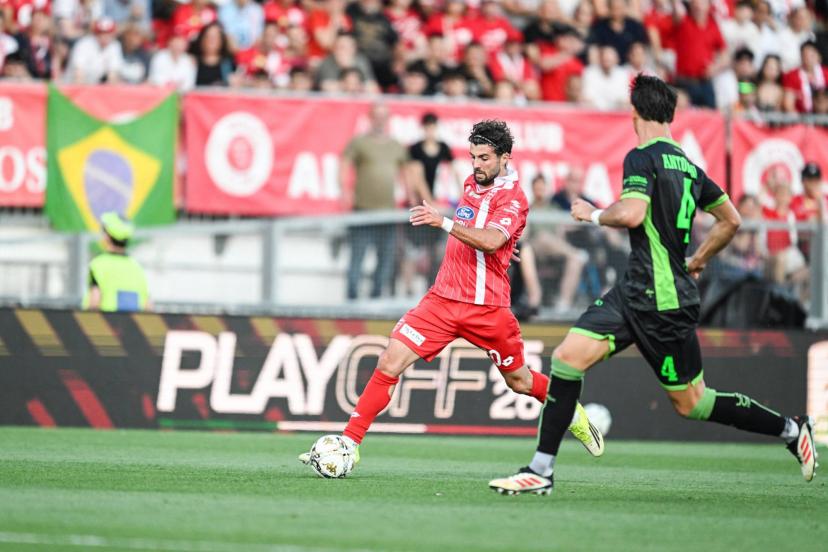 Patrick Cutrone and Monza players celebrate their Serie A promotion despite a tense play-off finale against Catanzaro