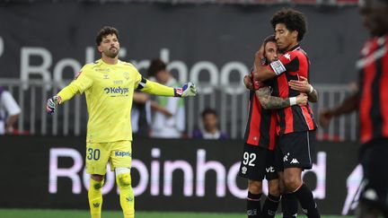 Nice players celebrate after securing Ligue 1 status in the playoff against Saint-Étienne
