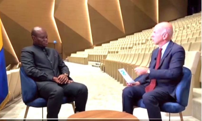 President Oligui Nguema in a formal discussion with a foreign correspondent