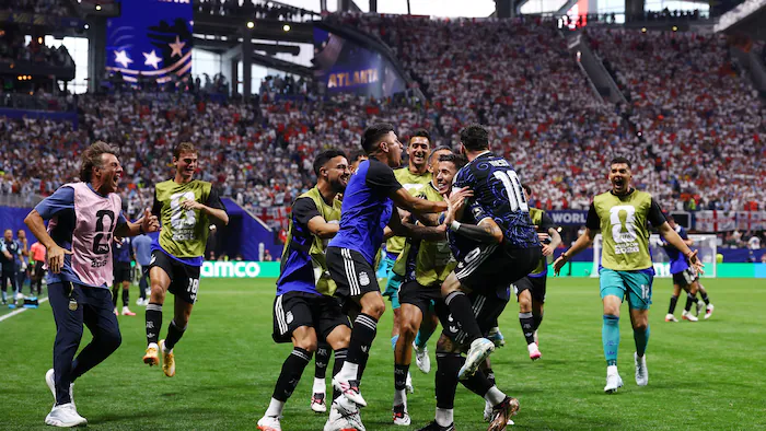 Soccer players celebrating a goal