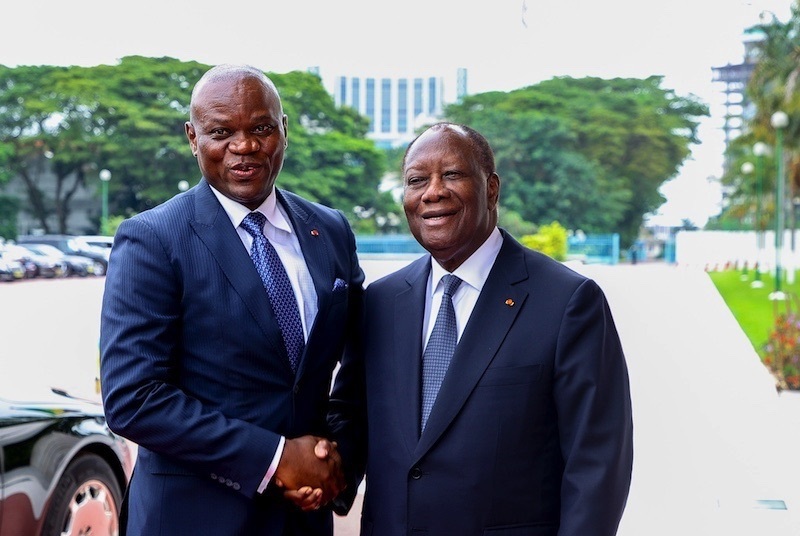 Gabon's President Brice Clotaire Oligui Nguema and Côte d'Ivoire's President Alassane Ouattara shaking hands