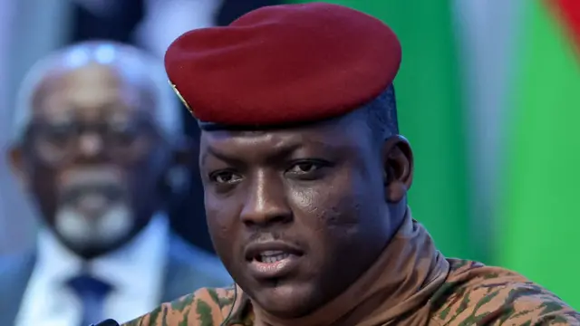 Close-up of Ibrahim Traoré in military uniform with red beret