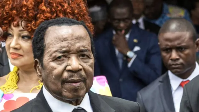 Paul Biya during one of his last public appearances in Cameroon, welcoming Pope Léon XIV in April 2026, surrounded by Cameroonian officials and his wife, First Lady Chantal Biya.