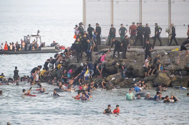 People crossing into Ceuta during the migration surge